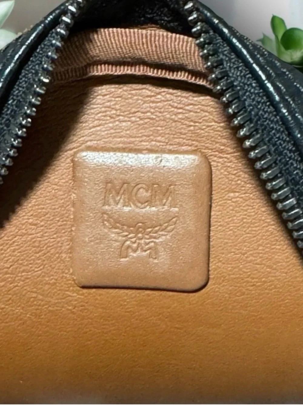 MCM Black Logo-Stamped Leather Mini Backpack with Stud Details